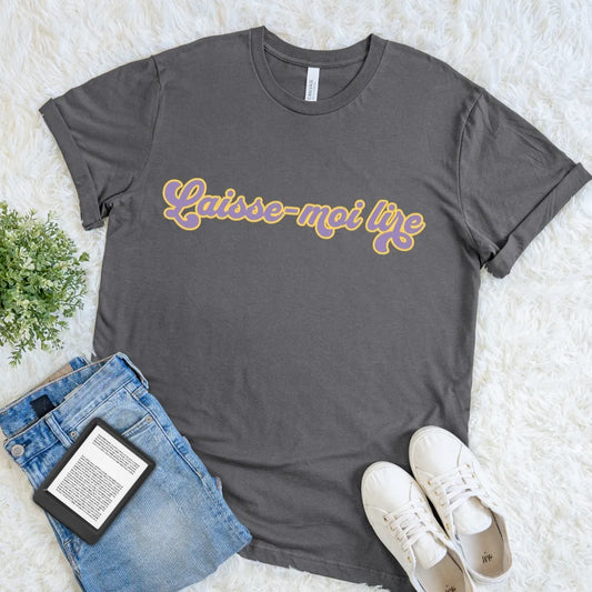 Asphalt Laisse-Moi Lire French reader T-shirt with colorful groovy retro typography, a playful bookish graphic tee for devoted readers and Francophiles.