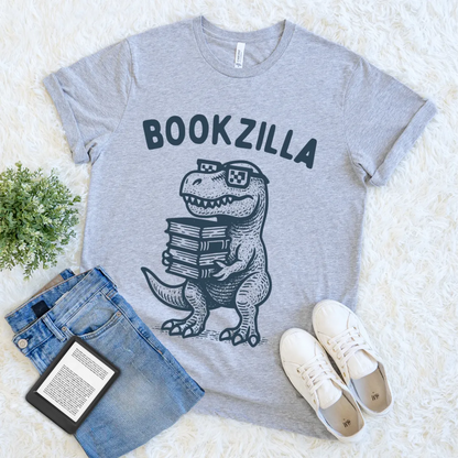 Quirky reader t-shirt with cartoon dino and stack of books