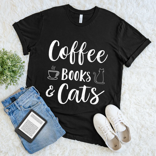 Black T-shirt with white text “Coffee Books & Cats” and minimalist doodle