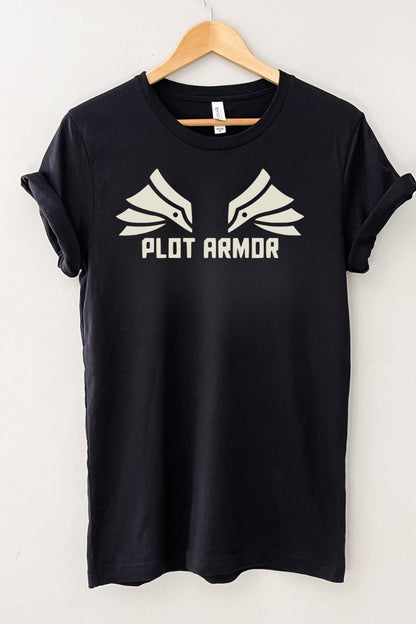 Black literary graphic t-shirt with “Plot Armor” text and minimalist wing design, styled as a casual bookworm aesthetic shirt