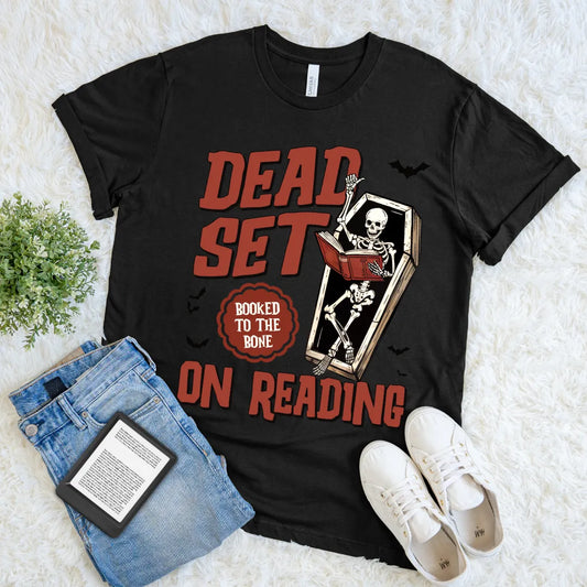 book lover Halloween tee with “Dead Set on Reading” slogan