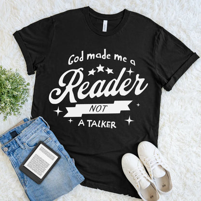Black soft cotton T-shirt  for book lovers with white text reading “God made me a reader not a talker” 