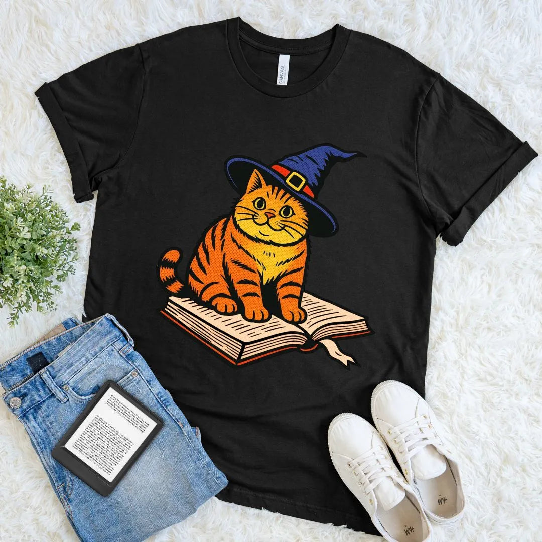 Black cozy Halloween reader T-shirt with cute wizard cat and book illustration for book lovers