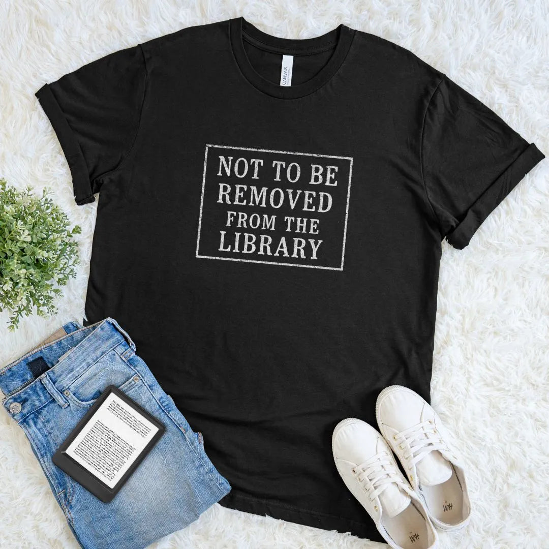 Soft cotton literary shirt styled in neutral tones with serif lettering library stamp