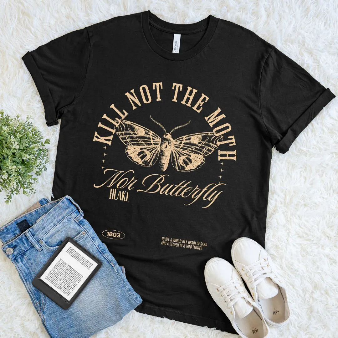 Soft cotton black t-shirt with butterfly graphic and dark academia poetry quote, paired with jeans and sneakers on a light background