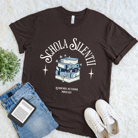 Cozy book lover T-shirt featuring academic themed artwork and Latin inspired typography text on brown fabric
