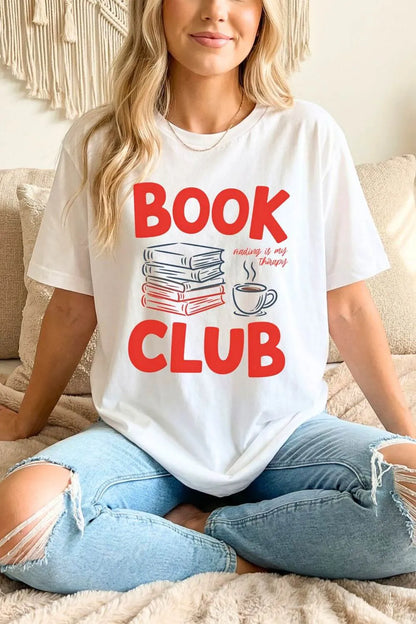 woman wearing a white t-shirt with 'Book Club' text and graphics styled with jeans for relaxed reading outfit