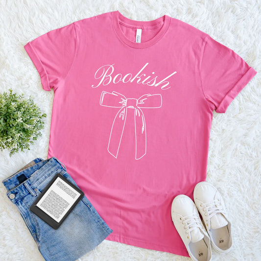 hot pink shirt with “Bookish” script and white bow