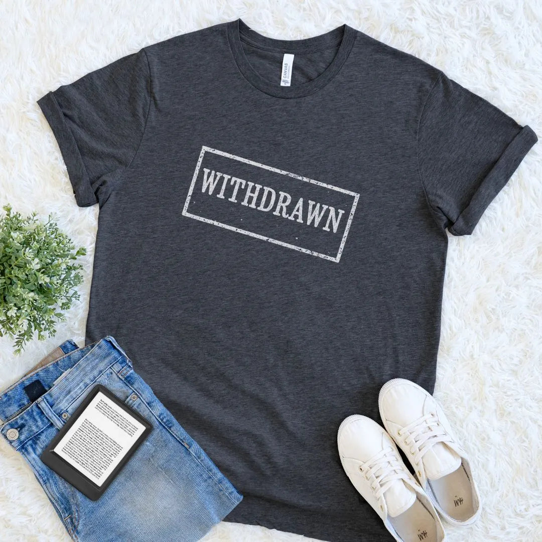 Flat lay of soft cotton introvert shirt with vintage library-style typography in dark grey heather 