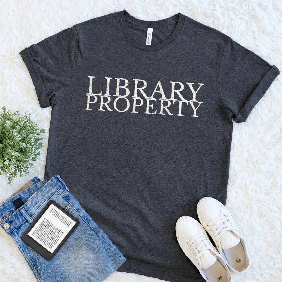 Dark Grey Heather Library Property bookish graphic tee with classic cream serif typography, an understated dark academia library shirt for avid readers.