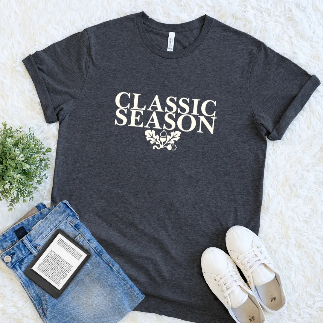 Dark Grey Heather Classic Season book lover T-shirt with vintage cream typography and oak leaf motif, an understated autumn tee for classic literature readers.