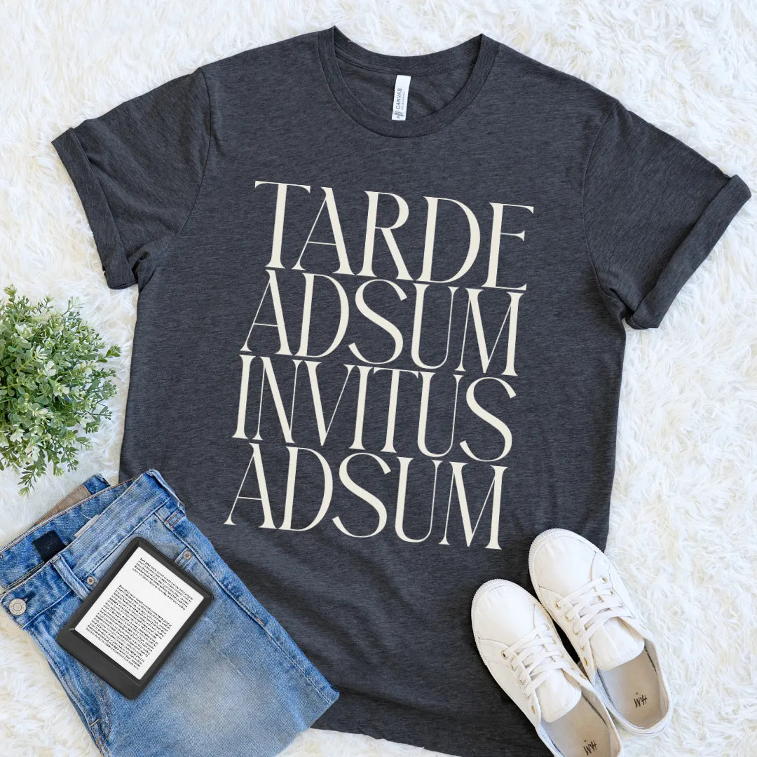 Dark Grey Heather Tarde Adsum Invitus Adsum T-shirt with bold cream Latin typography, a funny literary tee for introverts, readers, and academics.