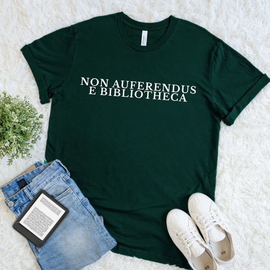 Forest green Non Auferendus E Bibliotheca library T-shirt with cream Latin quote typography meaning “do not remove from the library,” a dark academia book lover shirt for readers, librarians, bibliophiles, and literary humor fans.