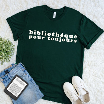 Forest green library T-shirt printed with the French phrase Bibliothèque Pour Toujours in warm cream vintage type