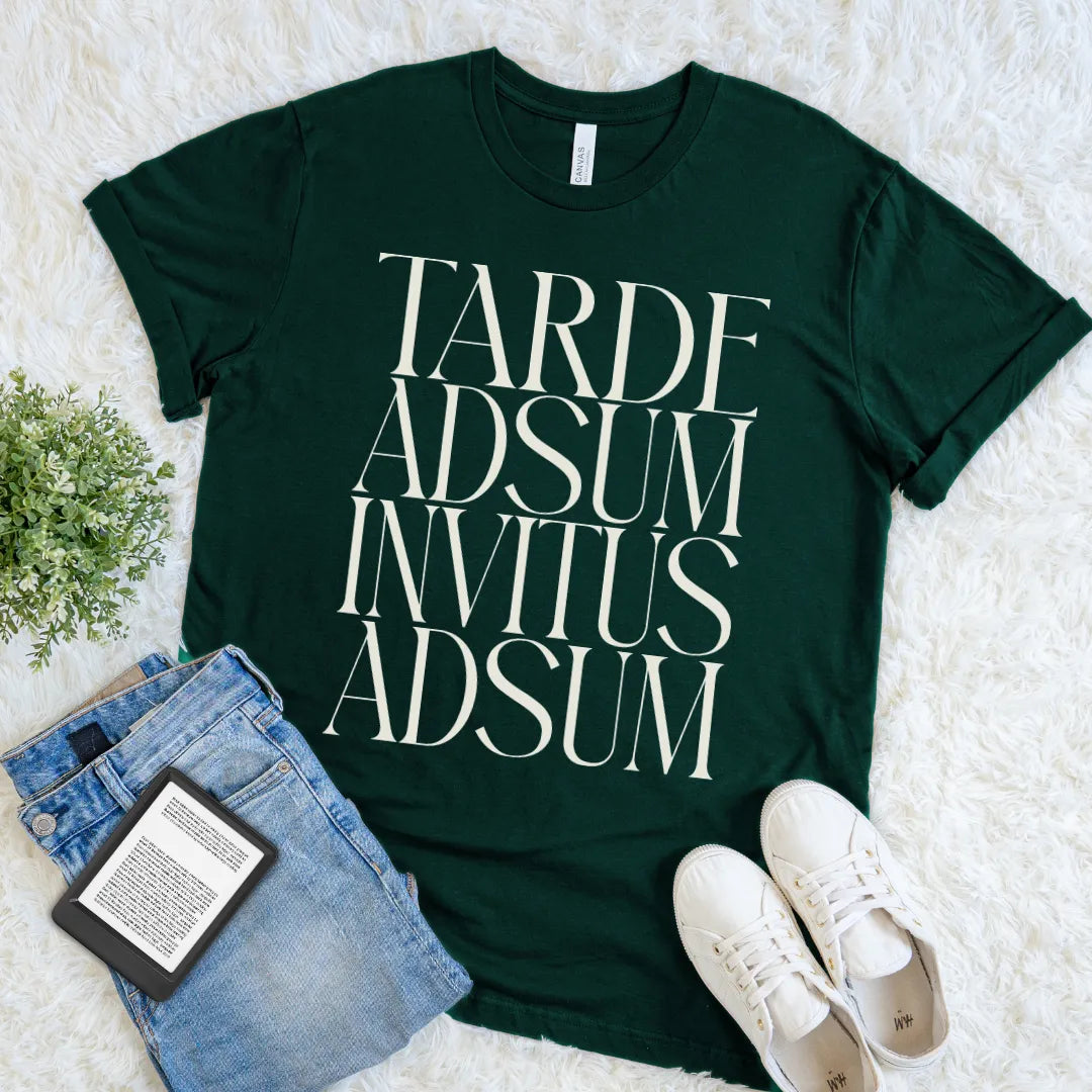 Forest green Tarde Adsum Invitus Adsum Latin quote T-shirt with oversized cream serif typography, a funny dark academia tee for introverts and classics lovers.