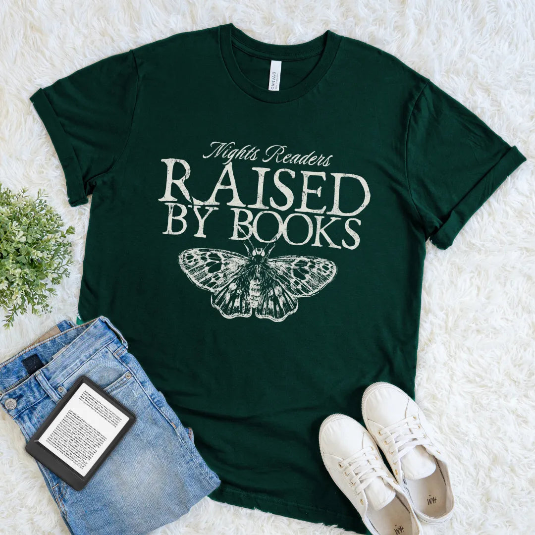 Minimalist bookish tee with bold typography and butterfly design on forest green cotton