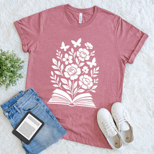 Heather mauve book lover shirt featuring blooming flowers from a book