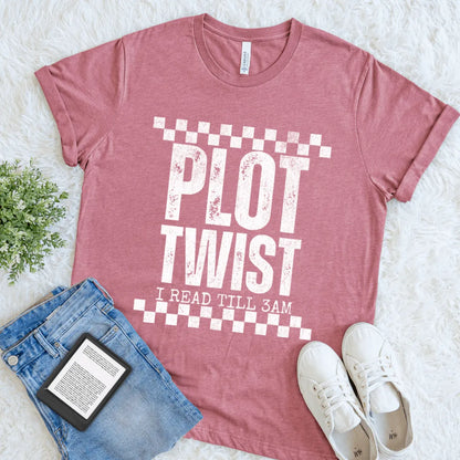 Funny heather maroon reader shirt styled with denim, sneakers, and an e-reader