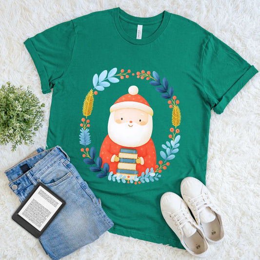 green t-shirt featuring cute Santa Claus holding a stack of books 