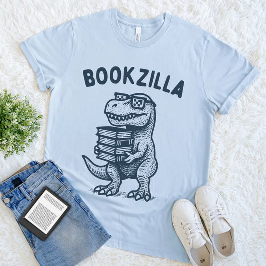 Light blue playful reader shirt with nerdy dino character and books