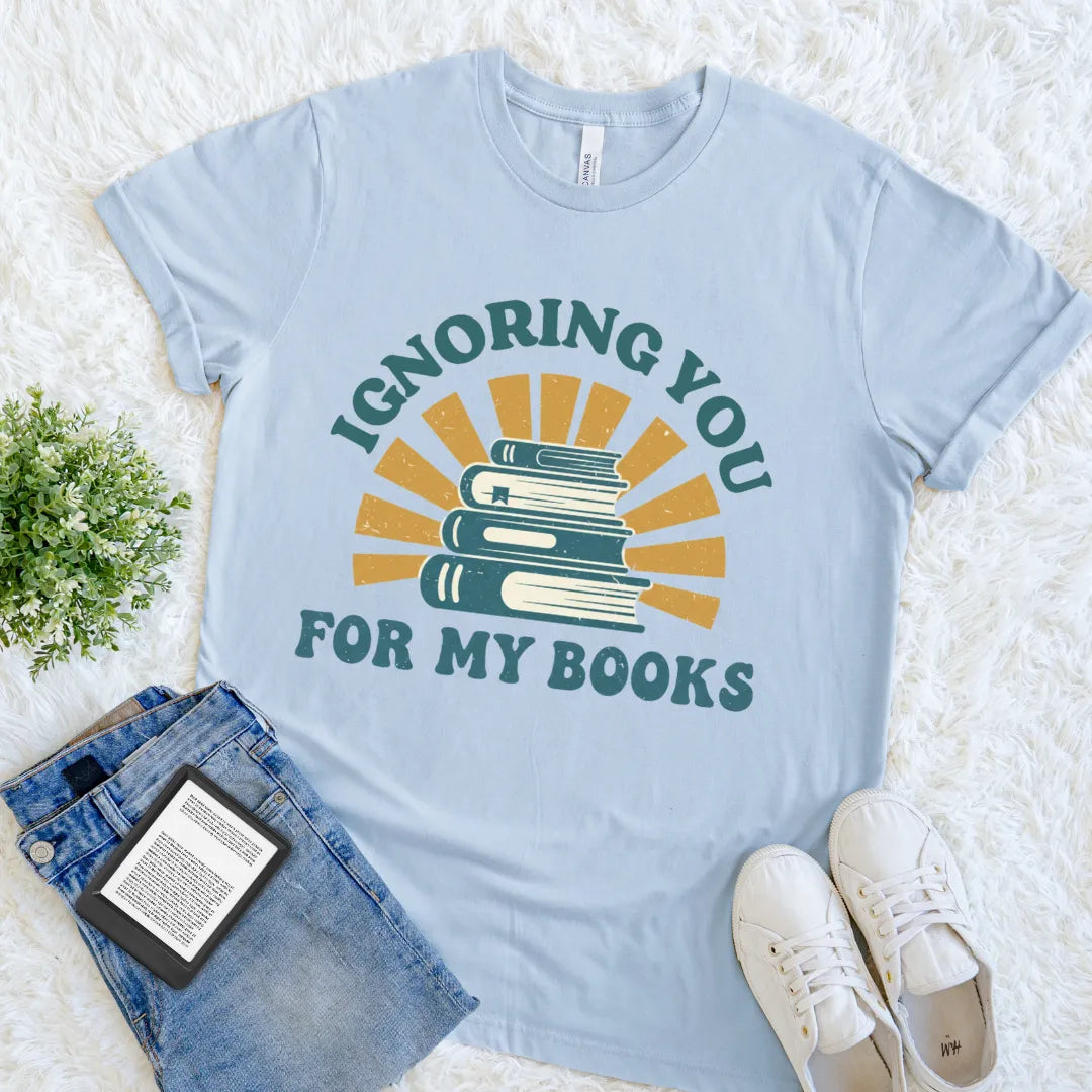 Funny introvert t shirt for book lovers and homebodies  featuring stack of books