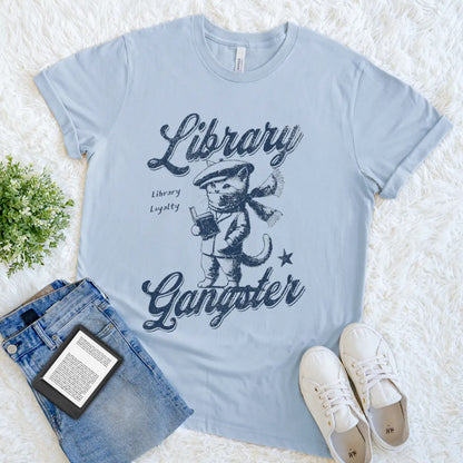 Soft cotton reader t-shirt featuring scarf-wearing cat with book and Library Gangster quote in light blue 