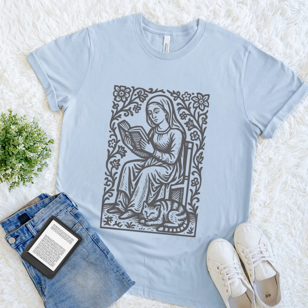 Vintage-inspired bookish shirt with detailed reader and cat illustration on light blue  cotton