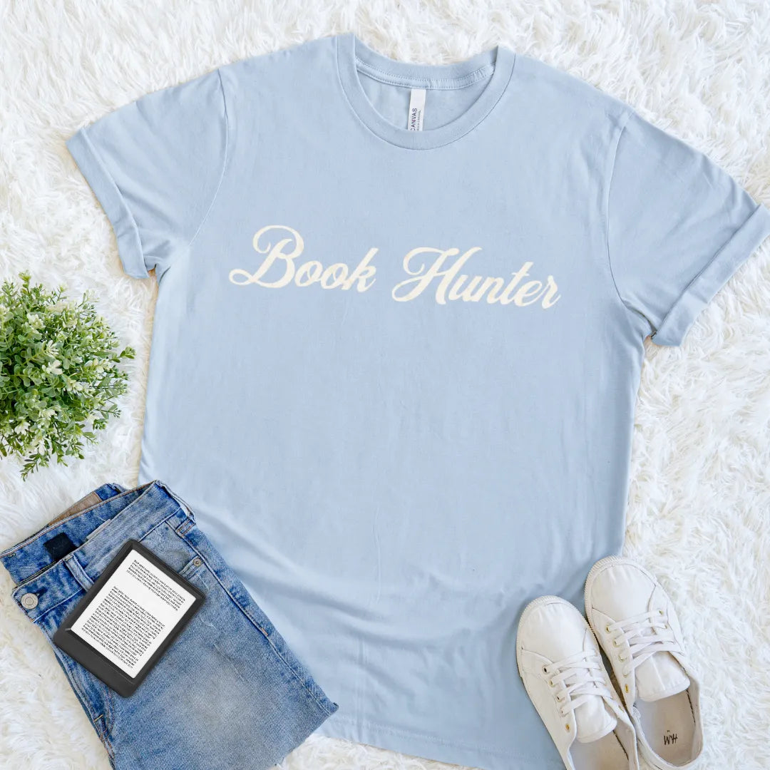 light blue book lover shirt with minimal text-based vintage reading design "book hunter"