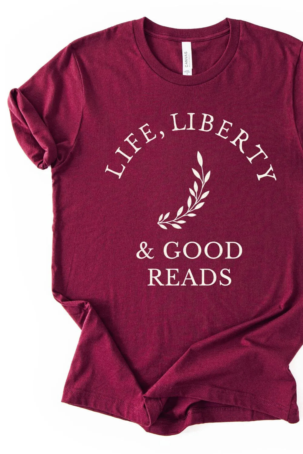 Maroon  reader shirt with 'Life, Liberty & Good Reads' text on a white background