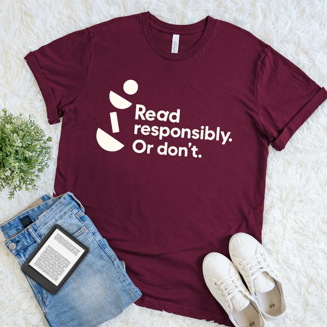 Maroon Read Responsibly Or Don’t literary humor T-shirt with crisp typography and geometric accents, a playful reader shirt for book lovers.