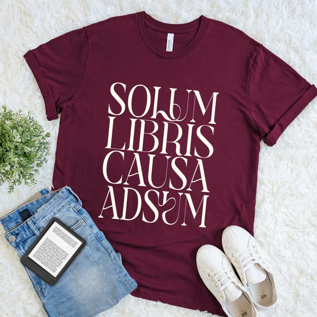 Maroon book lover T-shirt featuring Solum Libris Causa Adsum in elegant serif typography
