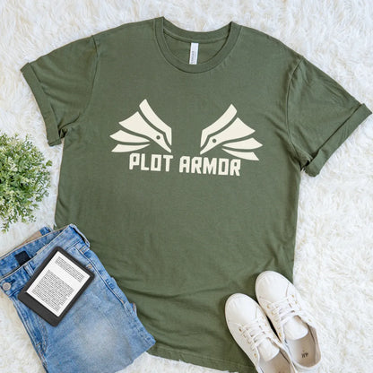 Flat lay of military green fantasy reader T-shirt with Plot Armor text and wing-inspired graphic