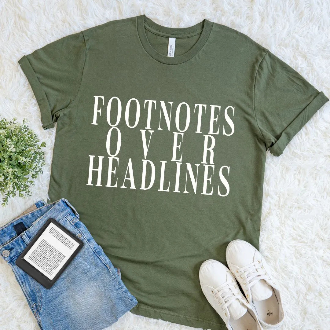 Soft cotton reader shirt with Footnotes Over Headlines literary slogan on olive green  fabric