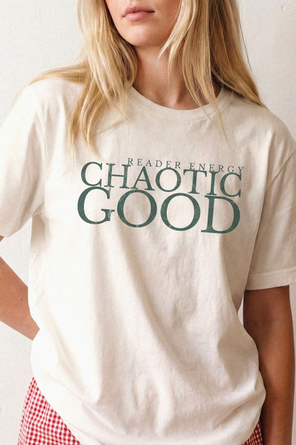 woman wearing a natural beige bookish t-shirt with 'READER ENERGY CHAOTIC GOOD' text in green