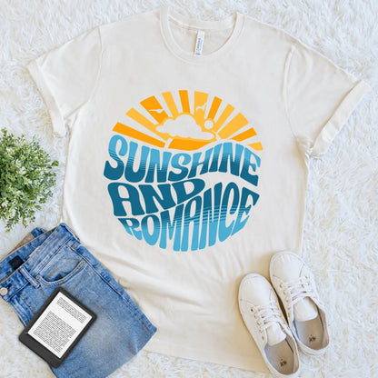 Flat lay of soft cotton  reader T-shirt with bold sunshine and romance graphic in cream
