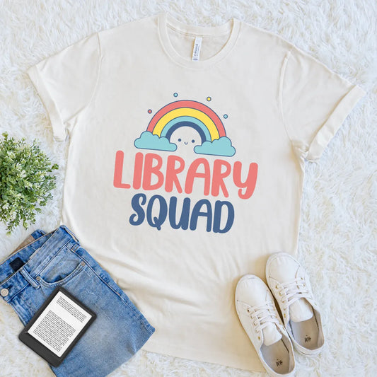 Cream T-shirt with “Library Squad” text and rainbow design