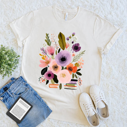 Cream T-shirt with floral bouquet growing from stacked books, literary aesthetic tee
