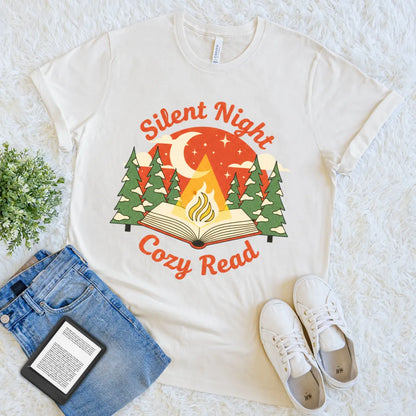 Cozy graphic t-shirt featuring a fire glowing from the pages of a book