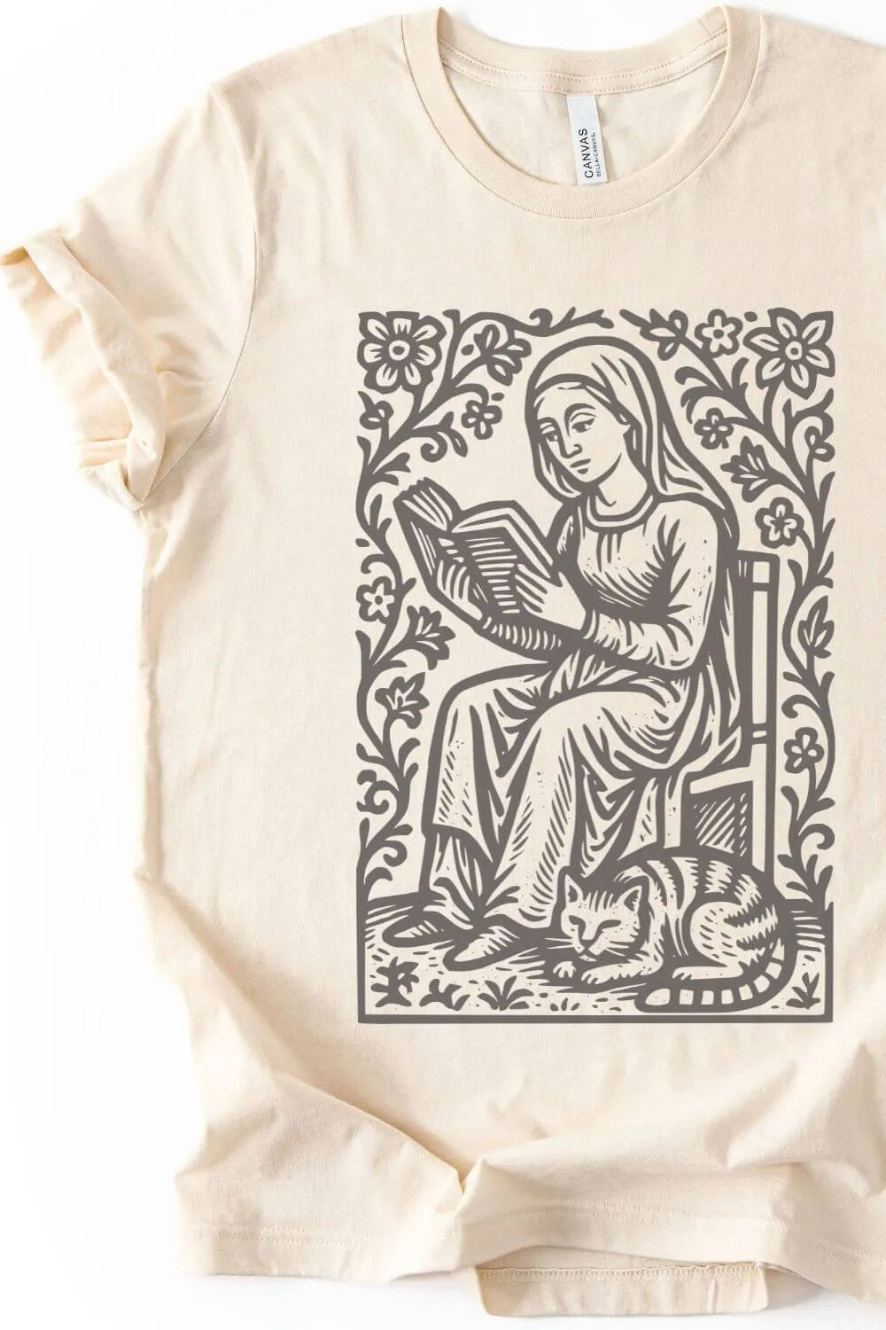 natural beige  vintage literary t-shirt with medieval-style reader and cat illustration, cozy cottagecore bookish aesthetic outfit