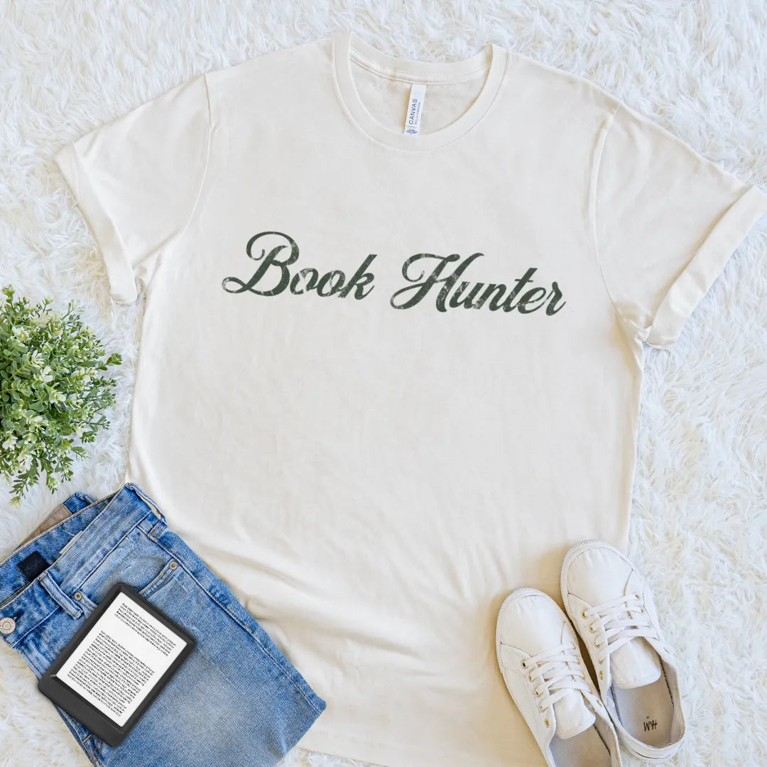 Cream book lover T-shirt with Book Hunter text in elegant vintage script