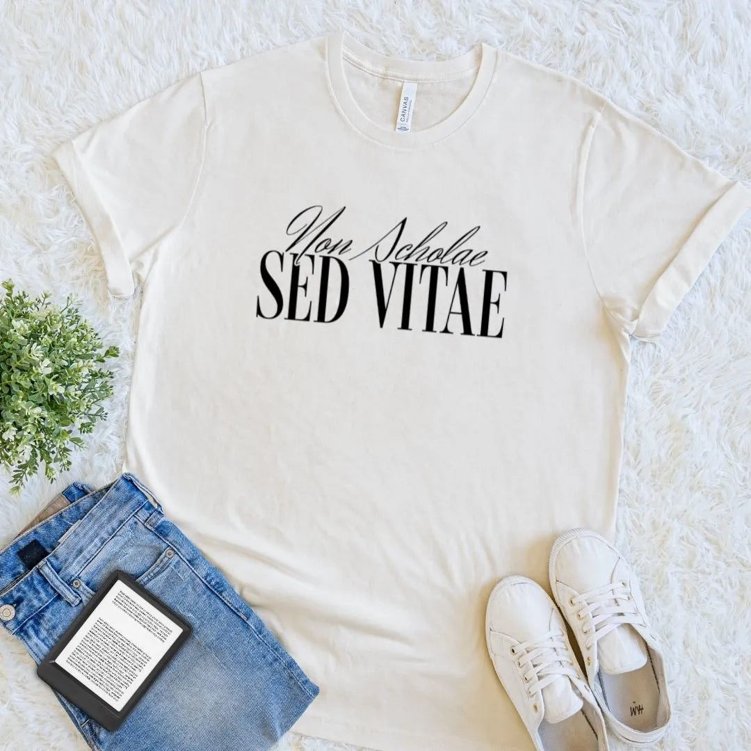 Beige soft cotton  t-shirt with “Non Scholae Sed Vitae”  latin quote in elegant font, celebrating lifelong learning