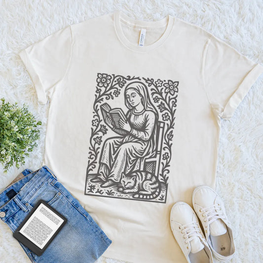 Cozy reader shirt featuring floral vintage artwork of woman reading a book with cat on natural beige cotton