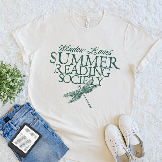 Cream book lover T-shirt with Summer Reading Society text and vintage dragonfly illustration