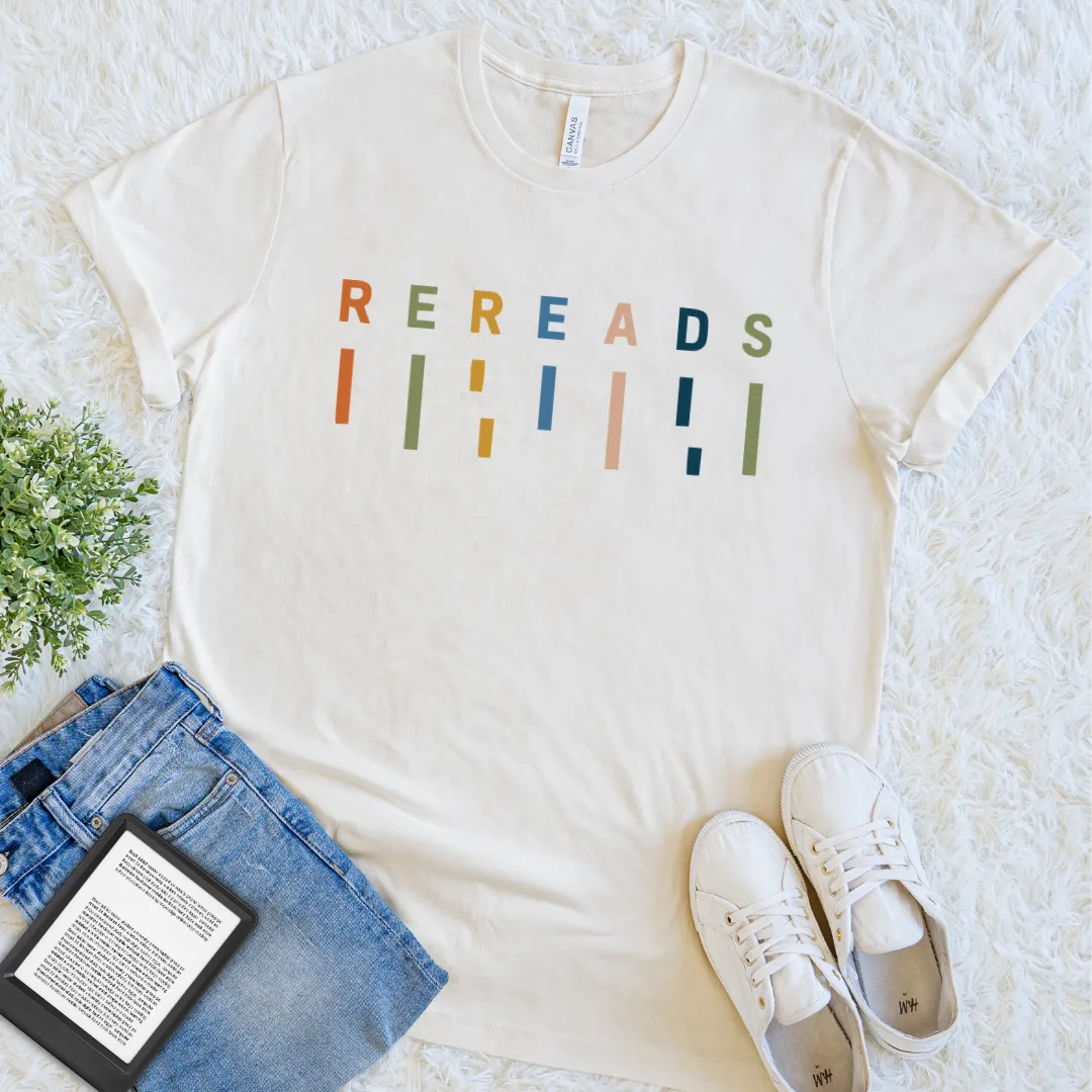 Natural bookish T-shirt with colorful Rereads typography and minimalist retro book-inspired graphics.