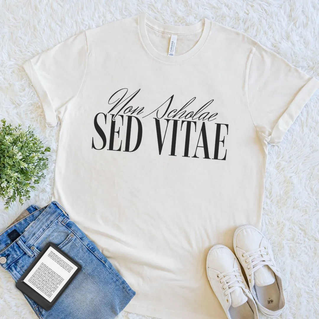 natural beige soft cotton  reader t-shirt with “Non Scholae Sed Vitae”  latin quote in elegant font, celebrating lifelong learning