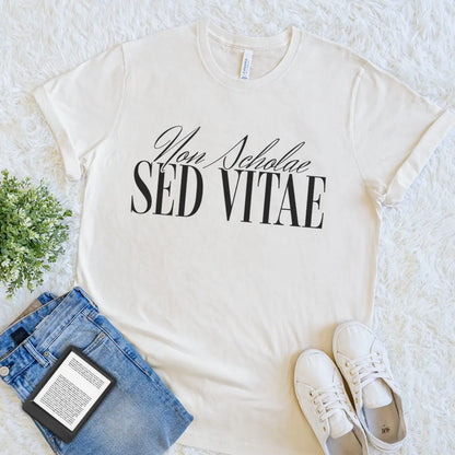 natural beige soft cotton  reader t-shirt with “Non Scholae Sed Vitae”  latin quote in elegant font, celebrating lifelong learning
