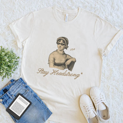 Cream soft cotton bookish T-shirt with vintage Jane Austen  wearing sunglasses illustration   and “Stay Headstrong” quote