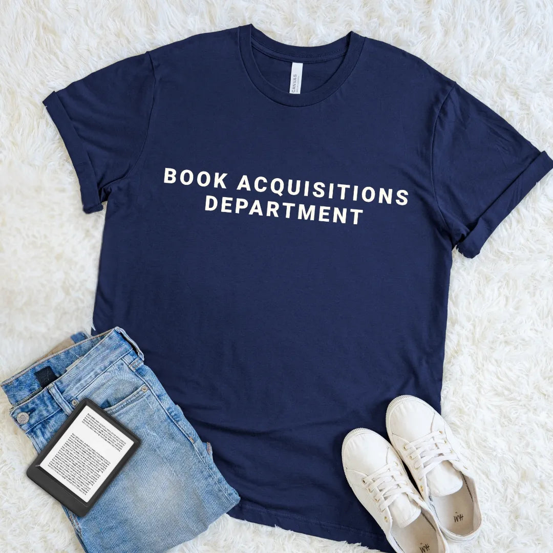 Navy book lover tee declaring Book Acquisitions Department in a clean minimalist design