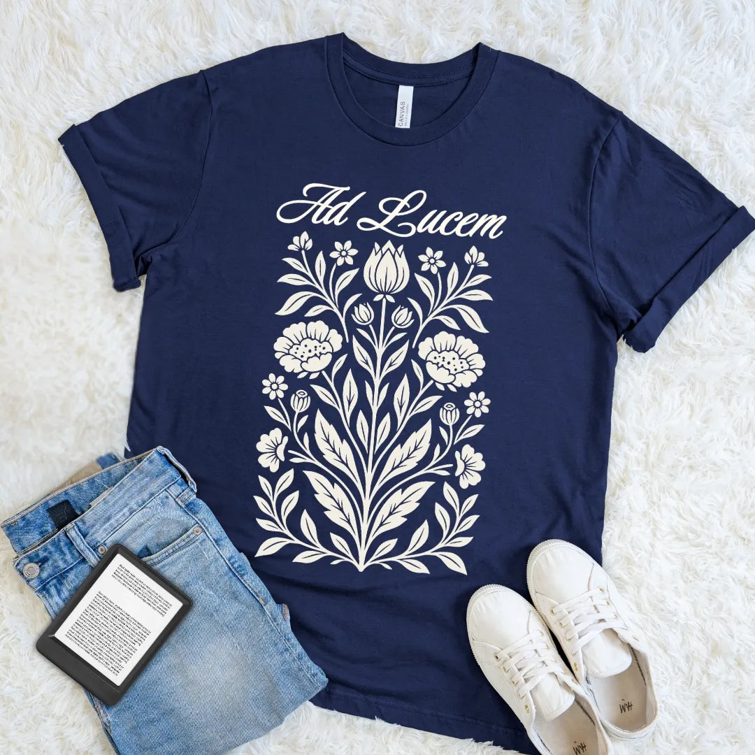 Navy Ad Lucem Latin T-shirt with vintage botanical artwork and elegant script, a dark academia floral tee meaning toward the light for thoughtful optimists.