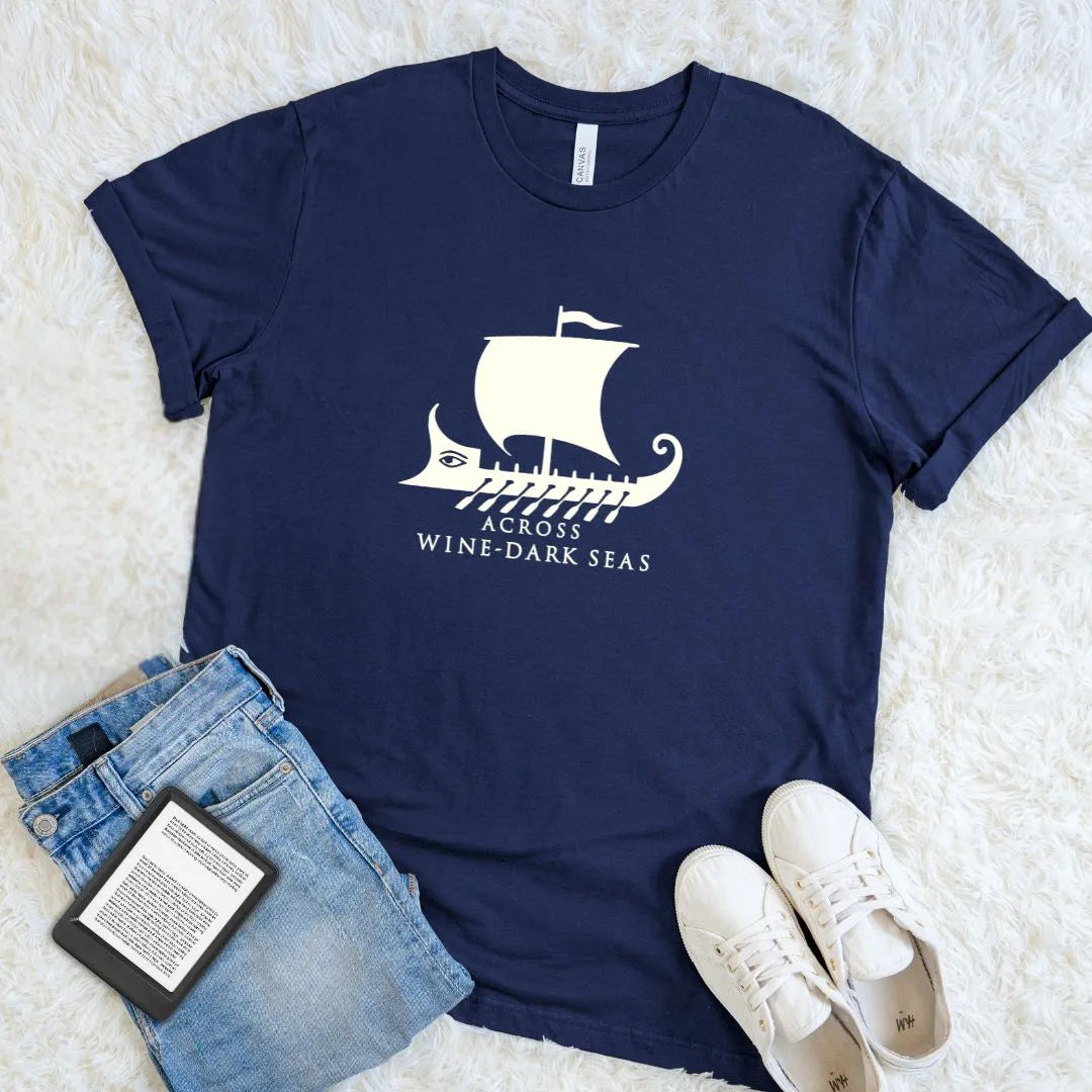 Soft cotton reader shirt inspired by Homer's Odyssey with Greek ship graphic and Across Wine-Dark Seas quote on navy cotton 
